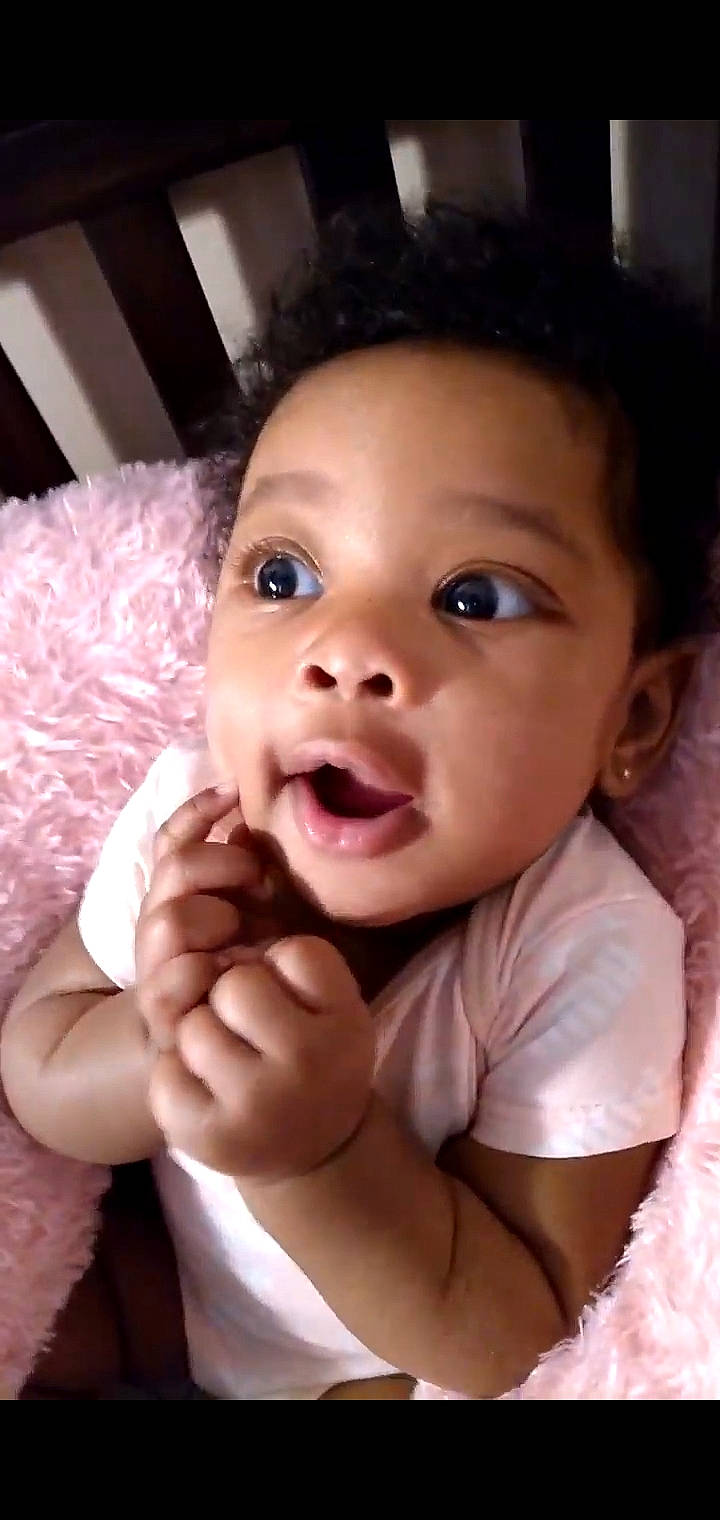 Ja'Layah is registered to the contest to win money with this photo: baby, cheek, chin, ear, eye, eyebrow, eyelash, face, gesture, hand, happy, head, human_body, jaw, lip, mammal, mouth, nose, person, skin