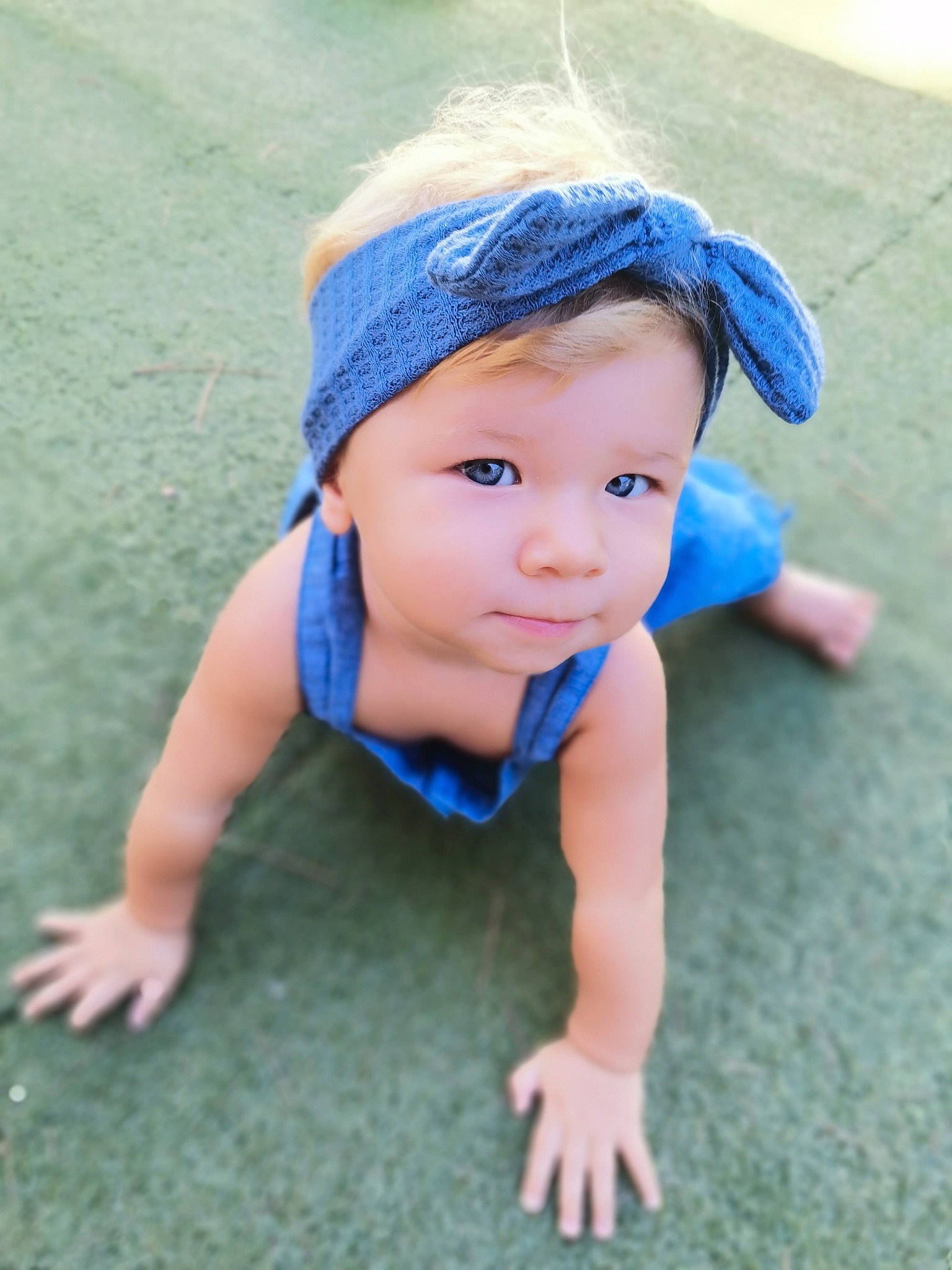 Oxana participe au concours pour gagner de l'argent avec cette photo : baby, baby_toddler_clothing, cap, child, chin, electric_blue, eye, facial_expression, fashion_accessory, fun, grass, happy, headgear, headwear, leisure, people_in_nature, person, play, sitting, skin