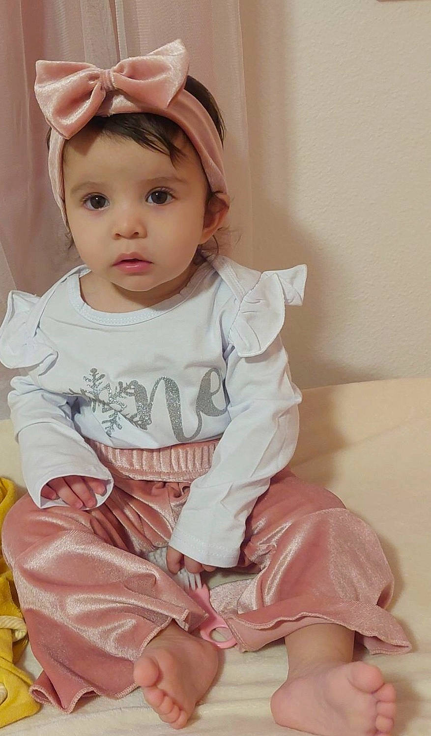 Aria is registered to the contest to win money with this photo: baby, baby_toddler_clothing, cap, cheek, child, chin, comfort, fashion_accessory, happy, headwear, lip, pattern, peach, person, pink, sitting, skin, sleeve, sock, t_shirt