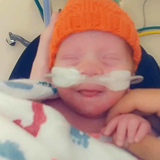 Brayden is registered to the contest to win money with this photo: bedtime, cheek, child, childbirth, ear, face, finger, forehead, hand, head, infant, lip, mouth, nose, play, product, skin, sleep, textile, toddler