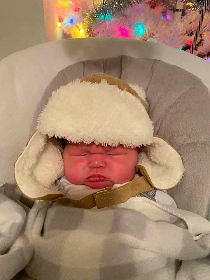 Alfred is registered to the contest to win money with this photo: baby, bonnet, child, fur, headgear, headwear, person, toddler