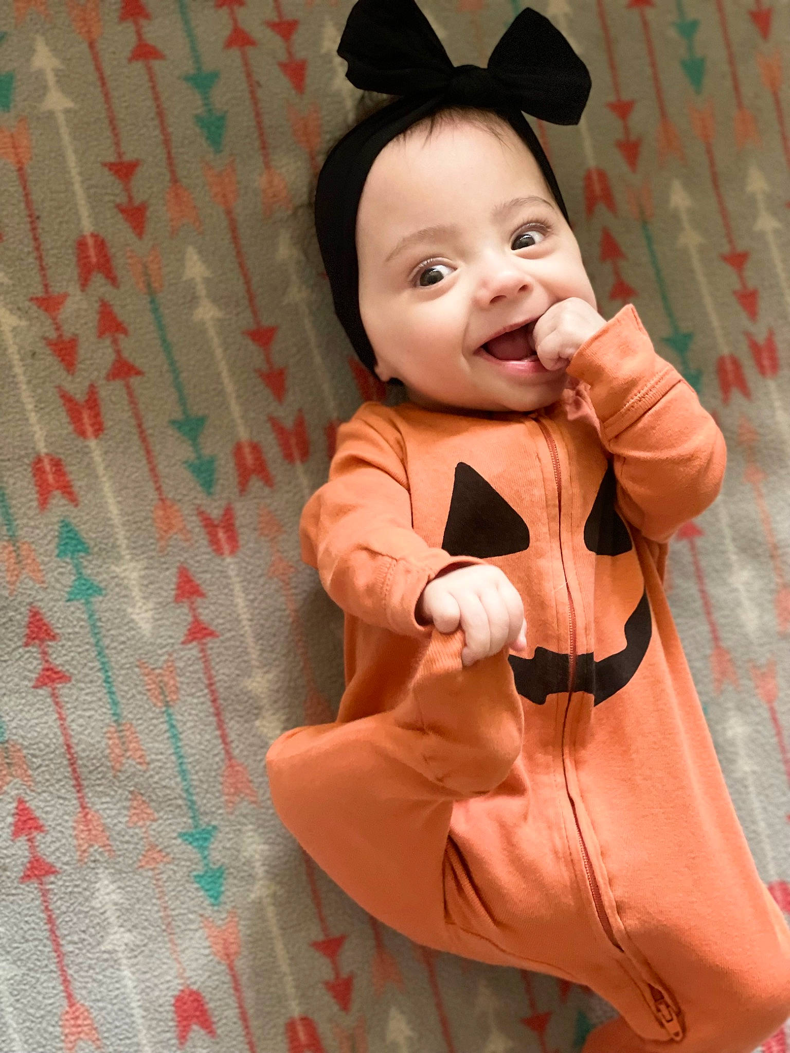 Lilly is registered to the contest to win money with this photo: baby, baby_toddler_clothing, child, collar, costume, dress, formal_wear, fur, happy, joy, linens, outerwear, pattern, peach, person, pink, skin, sleeve, smile, suit