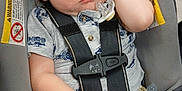 John joined the competition — help win amazing prizes! baby, child, car_seat, sleeping, pacifier, toddler, safety_harness, clothing, shorts, shirt, indoor, seatbelt, resting, cute, infant, person, peaceful, young_child, head, hand