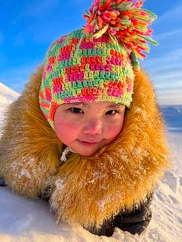 Hazel is registered to the contest to win money with this photo: beard, cap, clothing, eye, fur_clothing, hair, happy, head, headgear, headwear, human_body, jacket, knit_cap, outerwear, parka, people_in_nature, person, sky, smile, snow