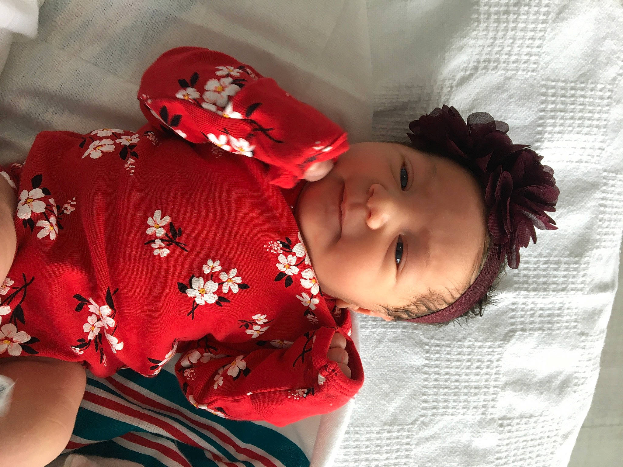Ja'Zara is registered to the contest to win money with this photo: baby, baby_toddler_clothing, carmine, child, comfort, elbow, facial_expression, fashion_accessory, fun, happy, hat, lip, magenta, pattern, person, pink, room, skin, sleeve, textile