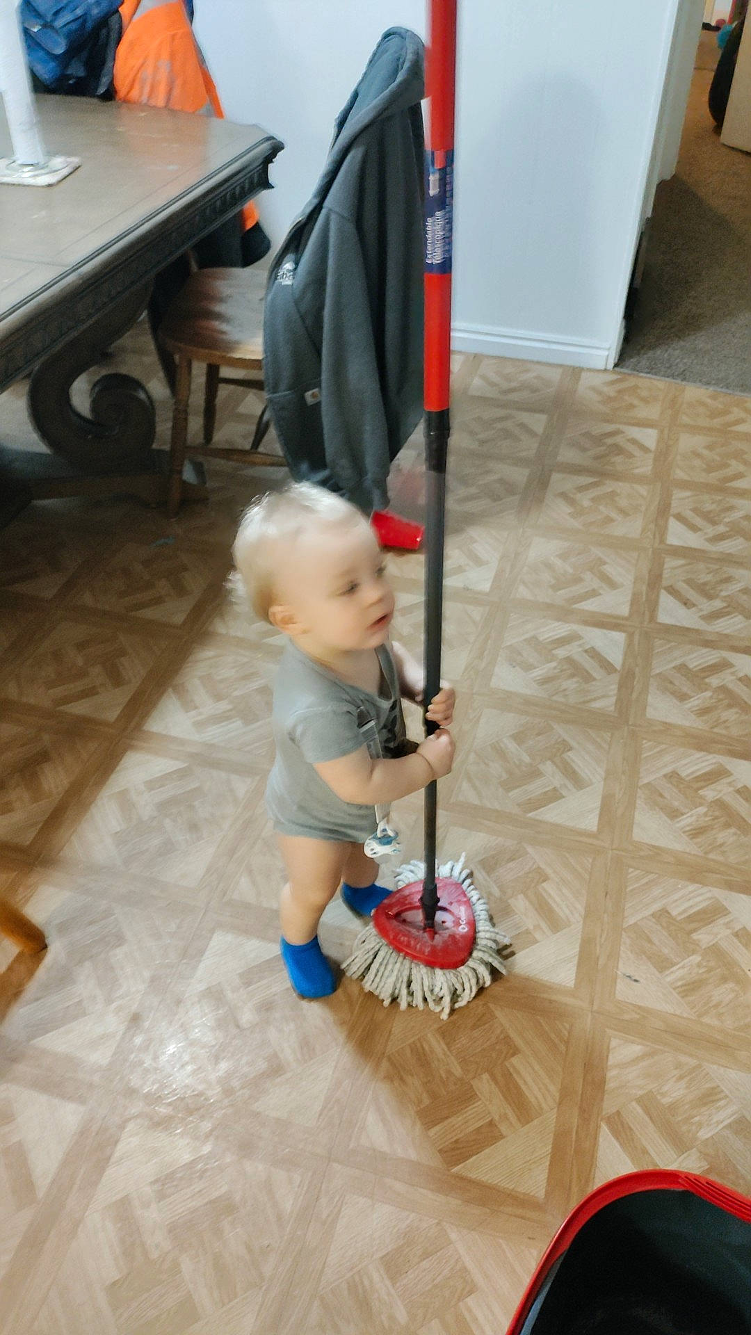 Landon joined the competition — help win amazing prizes! baby, baby_products, baby_toddler_clothing, child, cleanliness, floor, flooring, fun, hardwood, human_leg, knee, musical_instrument, person, play, room, shorts, sitting, thigh, toddler, toy