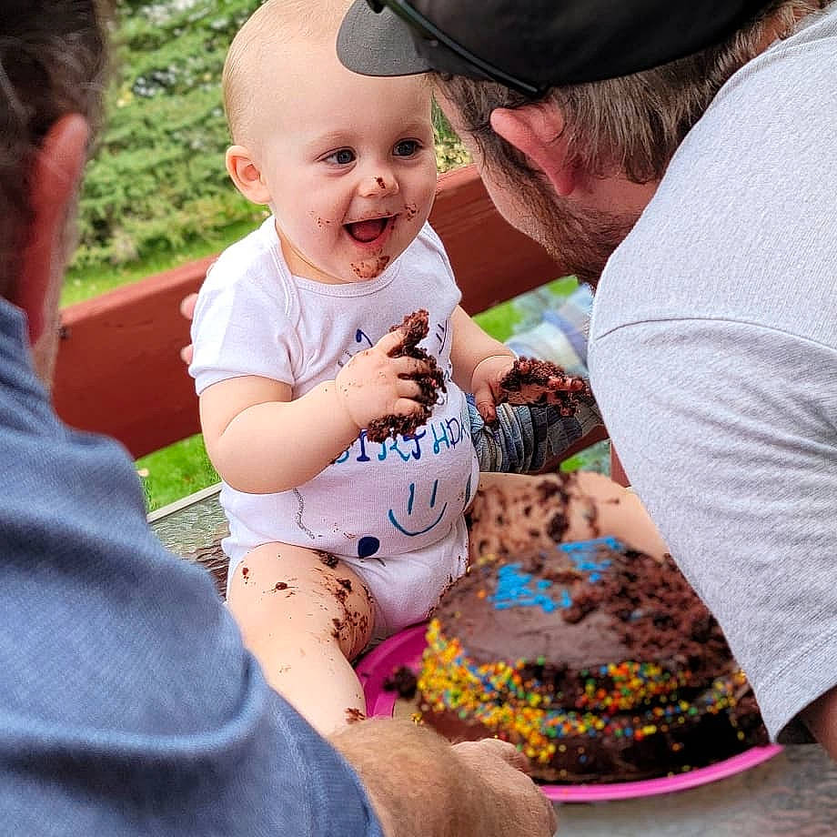 Landon joined the competition — help win amazing prizes! baby, baby_toddler_clothing, baseball_cap, cap, child, clothing, event, face, fun, gesture, grass, happy, hat, joy, lap, people, person, pink, recreation, smile