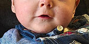 Logan participe au concours pour gagner de l'argent avec cette photo : baby, badge, bodypart, clothing, coat, face, finger, hand, head, jacket, jeans, knitwear, logo, pants, person, photography, portrait, sweater, symbol, vest