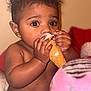 baby, child, ice_cream, cone, cute, curly_hair, big_eyes, eating, hand, face, blanket, indoors, portrait, food, sweet, chubby_cheeks, diaper, skin, warm_lighting, closeup