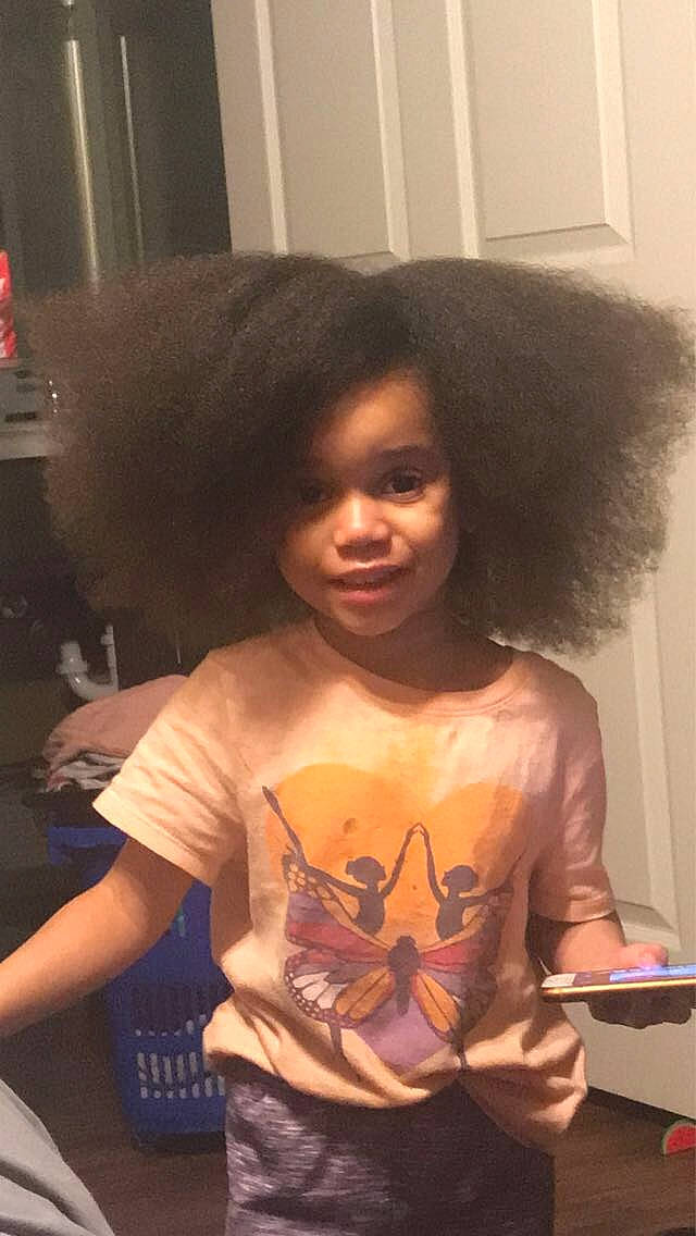 Saroyah joined the competition — help win amazing prizes! afro, black_hair, cheek, child, event, eye, forehead, fun, fur, hairstyle, happy, human, mammal, party, person, sitting, smile, standing, t_shirt, toddler