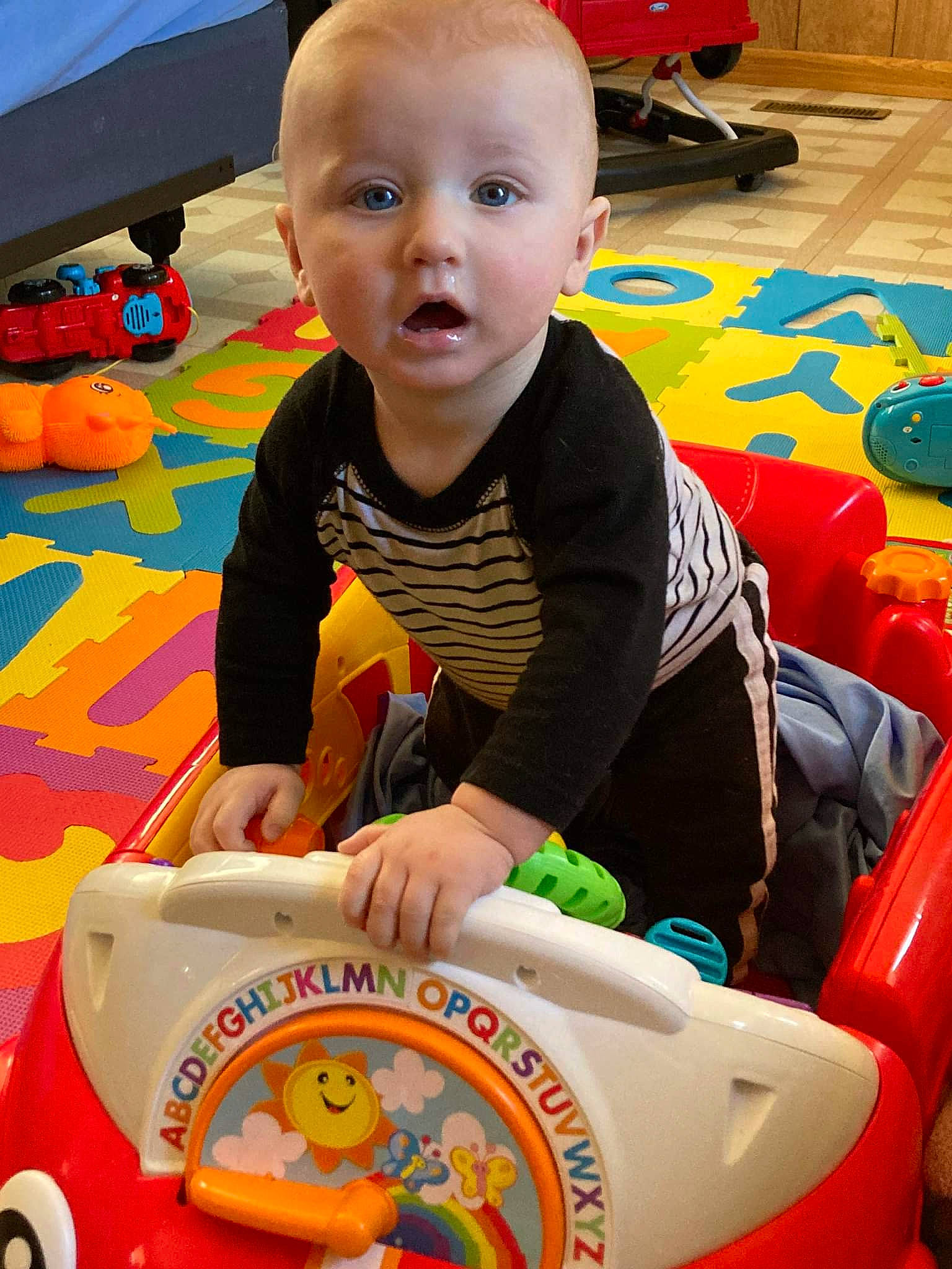 Jaiveon is registered to the contest to win money with this photo: baby, baby_playing_with_toys, baby_products, baby_toddler_clothing, baby_toys, child, event, floor, flooring, fun, leisure, organ, person, product, recreation, room, sitting, surprise, toddler, toy