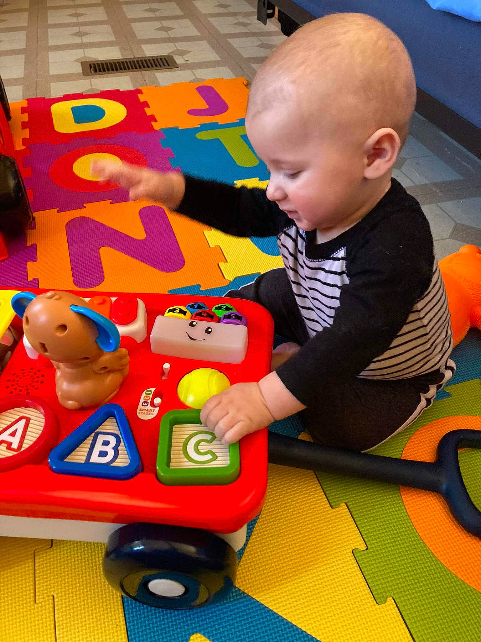 Jaiveon is registered to the contest to win money with this photo: baby, baby_playing_with_toys, baby_products, baby_toddler_clothing, baby_toys, blue, child, flooring, fun, learning, leisure, person, play, recreation, room, sharing, sitting, toddler, toy, toy_vehicle