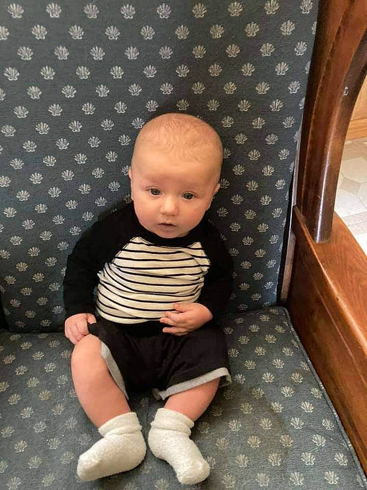 Jr is registered to the contest to win money with this photo: baby, baby_toddler_clothing, cheek, comfort, eye, floor, flooring, foot, head, knee, pattern, person, product, shorts, skin, sleeve, sock, t_shirt, thigh, toddler