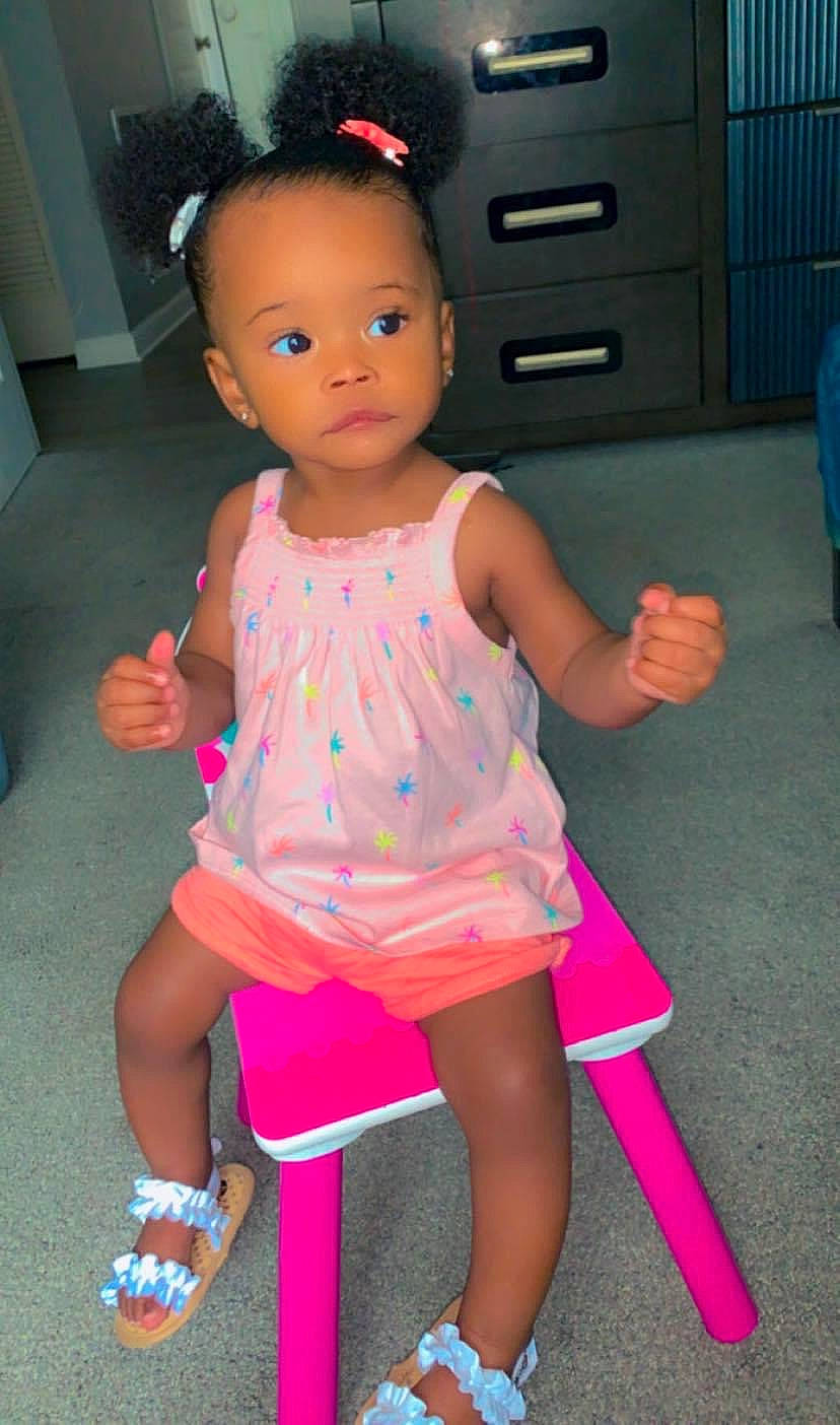 Malani joined the competition — help win amazing prizes! baby_toddler_clothing, cabinetry, child, drawer, eyelash, flooring, fun, happy, human_leg, joint, knee, magenta, neck, person, pink, sandal, sock, standing, thigh, thumb