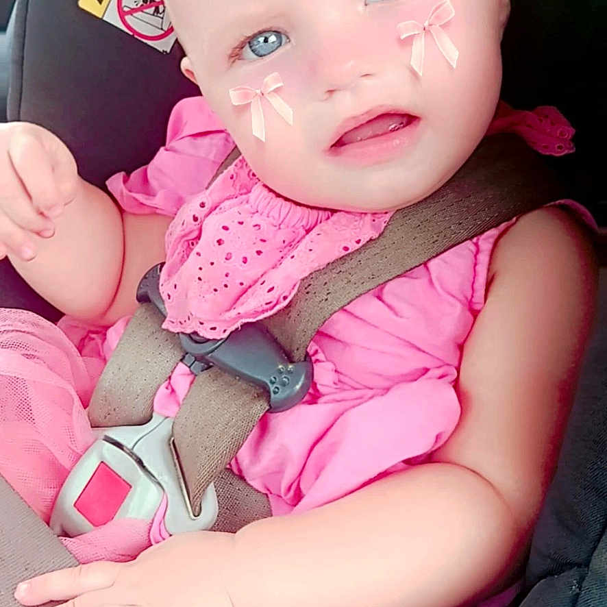 Brixley May Powell is registered to the contest to win money with this photo: accessories, baby, belt, bodypart, car, clothing, cushion, dress, face, head, homedecor, person, photography, portrait, purple, seatbelt, t_shirt, toy, transportation, vehicle