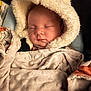 Luna is registered to the contest to win money with this photo: baby, sleeping, blanket, hood, cozy, infant, soft_texture, face, peaceful, wrapped, child, warm, cute, portrait, resting, comfort, indoors, newborn, clothing, toddler