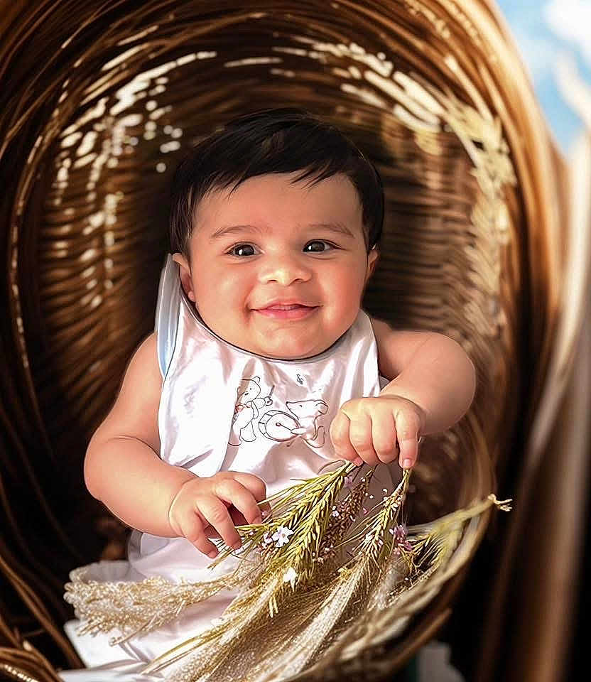 Ayan participe au concours pour gagner de l'argent avec cette photo : baby, infant, smiling, face, hand, flower, basket, wicker, dried_flower, cute, child, portrait, happy, indoors, person, clothing, white_outfit, skin, head, sitting