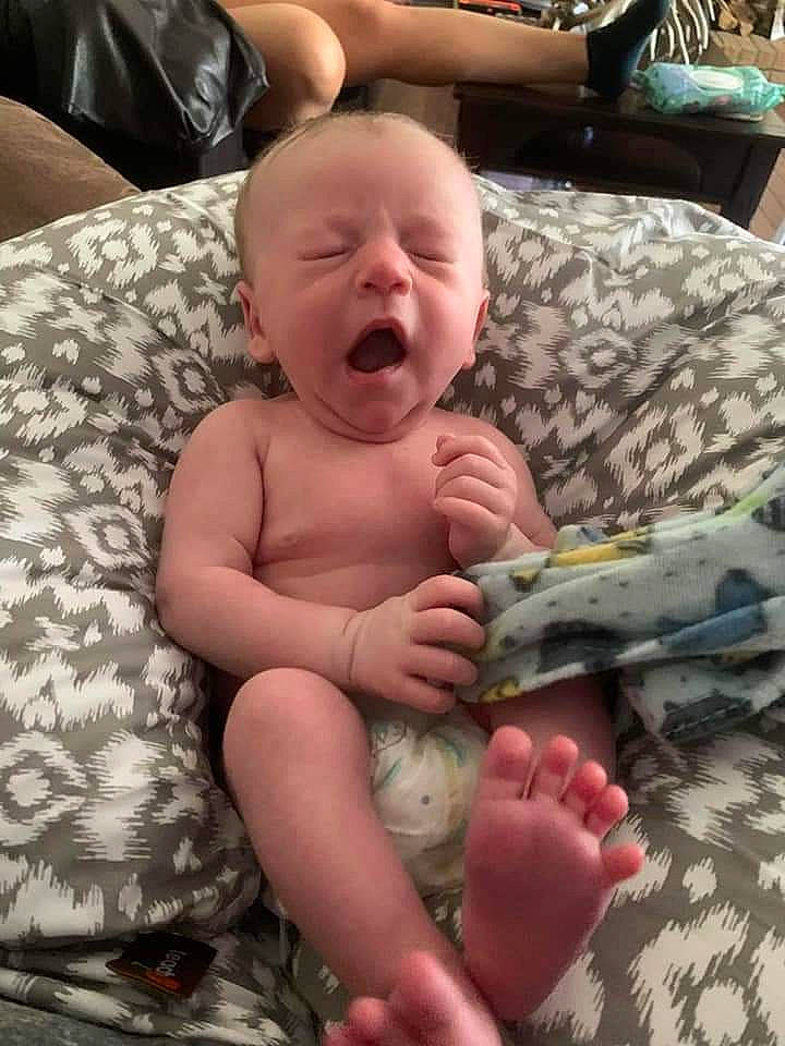 Lukas is registered to the contest to win money with this photo: abdomen, baby, baby_products, barefoot, cheek, chest, child, comfort, event, foot, human_leg, lap, linens, military_camouflage, person, skin, stomach, thigh, thumb, toddler