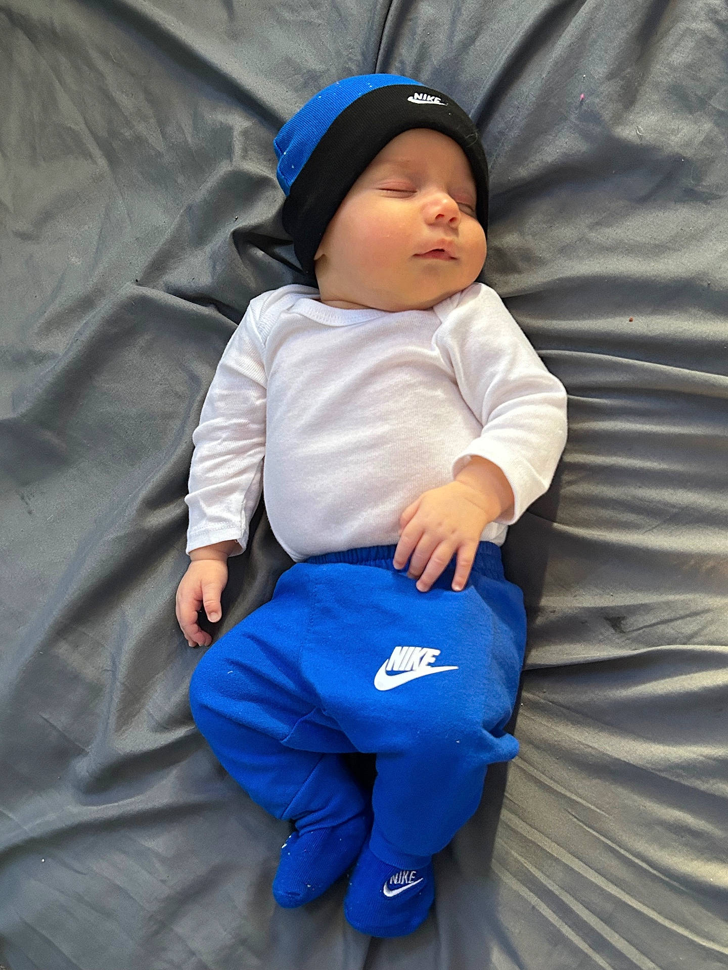 Damon joined the competition — help win amazing prizes! baby, baseballcap, cap, clothing, cushion, face, glove, hat, head, homedecor, jeans, newborn, pants, person, photography, portrait, shorts, sitting, sleeping, t_shirt