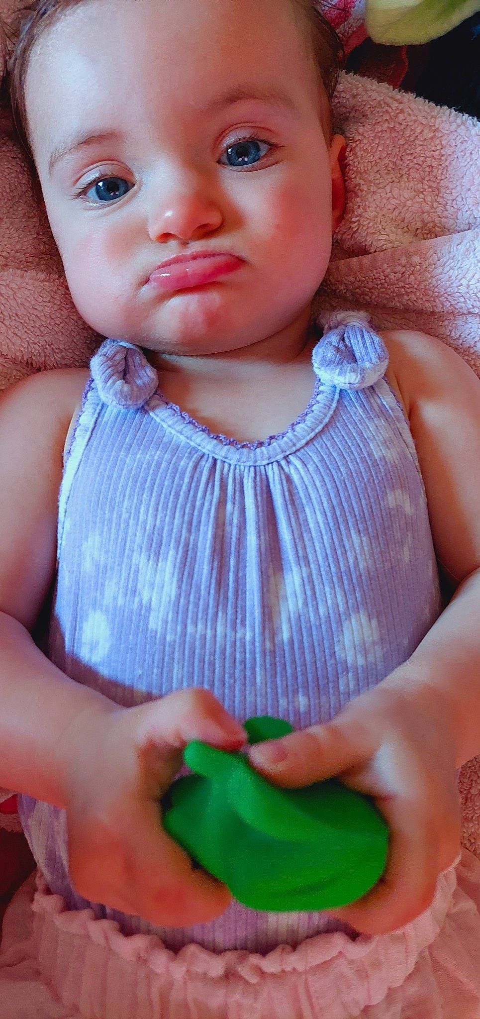 Charli is registered to the contest to win money with this photo: baby_toddler_clothing, blue, brown_hair, cheek, child, doll, eyelash, fashion_accessory, finger, green, jewellery, lip, nail, neck, nose, person, pink, sleeveless_shirt, thumb, toddler