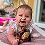Ava participe au concours pour gagner de l'argent avec cette photo : baby, background_blur, candid, child, close_up, clothing, cute, expression, face, hand, happy, indoor, infant, play_mat, plush_toy, portrait, skin, smiling, soft_lighting, toddler