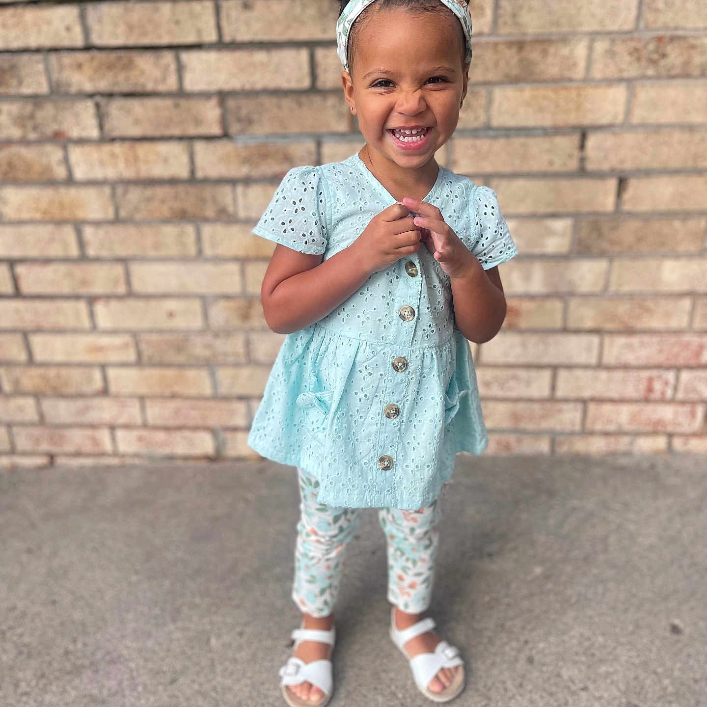 Leilani joined the competition — help win amazing prizes! child, clothing, coat, dress, face, female, footwear, girl, happy, head, jeans, pants, person, photography, portrait, sandal, sitting, sleeve, smile, standing