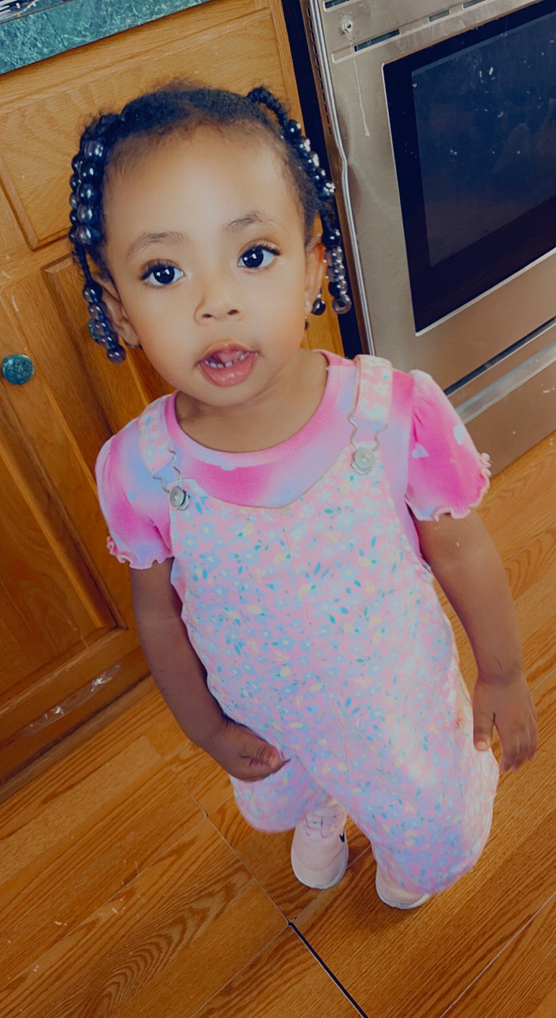 Serenity is registered to the contest to win money with this photo: baby_toddler_clothing, cheek, eye, eyebrow, eyelash, face, facial_expression, happy, head, iris, neck, organ, person, photograph, pink, purple, skin, sleeve, standing, toddler