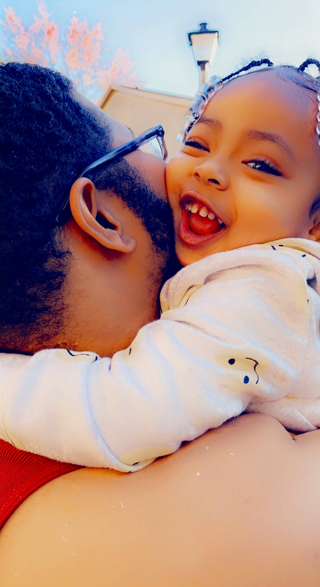 Serenity is registered to the contest to win money with this photo: baby, child, electric_blue, eye, eyewear, face, fun, gesture, happy, hat, hug, laugh, leisure, lip, love, people_in_nature, person, skin, smile, thumb