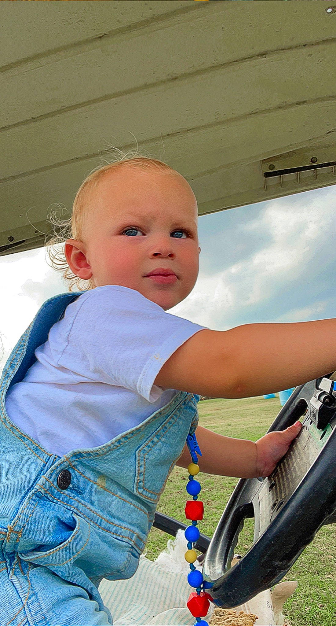 Caysen joined the competition — help win amazing prizes! automotive_lighting, automotive_tire, azure, baby, baby_products, baby_toddler_clothing, cloud, electric_blue, fun, happy, leisure, motor_vehicle, person, rim, sitting, sky, tire, toddler, vehicle_door, wheel