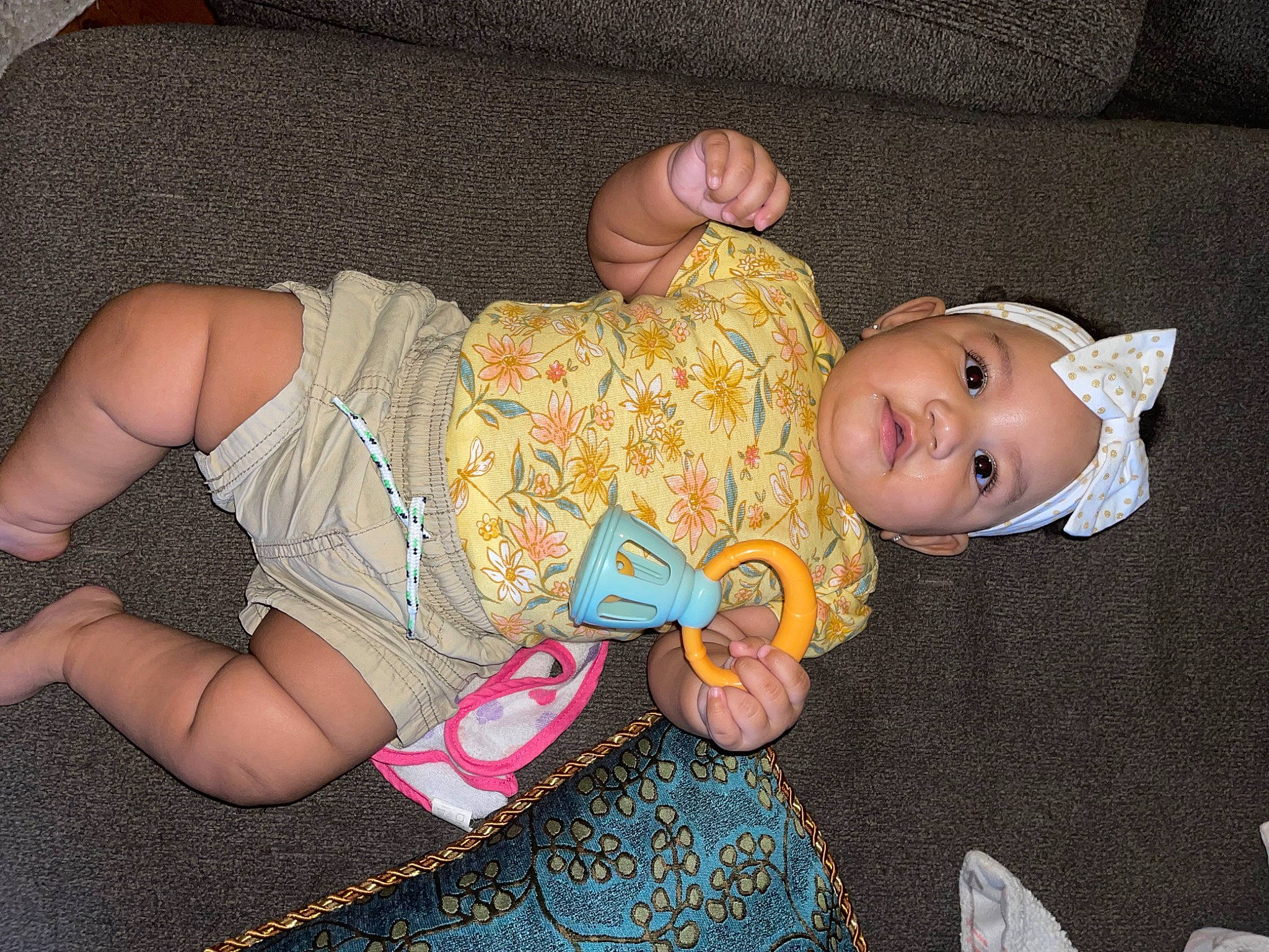 Jalayna is registered to the contest to win money with this photo: baby, baby_products, baby_toddler_clothing, cheek, child, comfort, doll, eye, fun, human_leg, lap, nail, pattern, person, pink, sitting, skin, thigh, toddler, toy