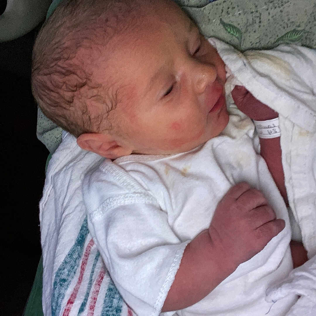 Colton joined the competition — help win amazing prizes! architecture, baby, bed, bedroom, blanket, building, clothing, couch, cushion, face, furniture, glove, head, homedecor, hospital, indoors, linen, newborn, person, photography