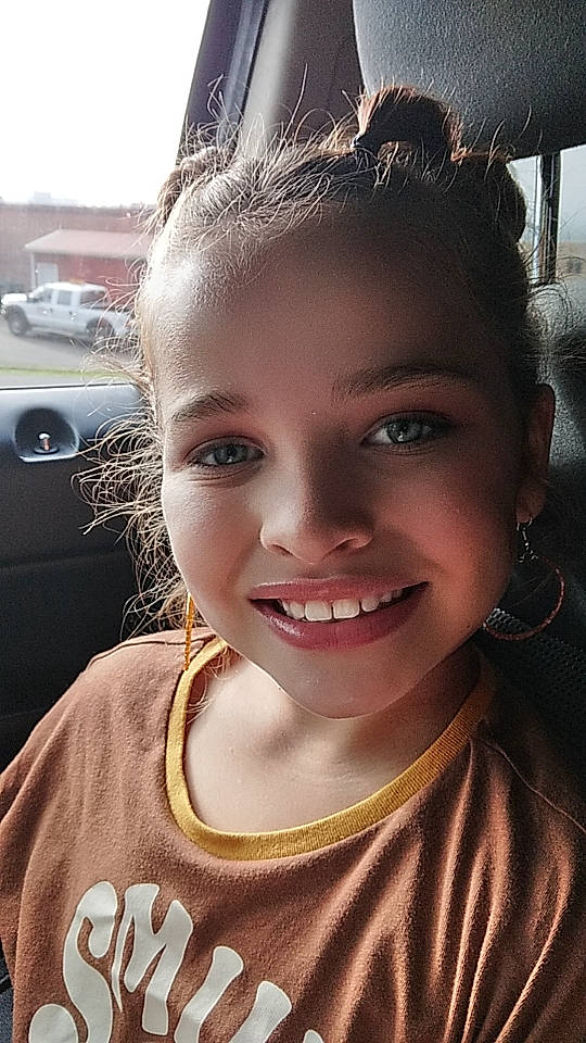 Brynleigh is registered to the contest to win money with this photo: chin, dress, eyebrow, eyelash, face, facial_expression, flash_photography, forehead, hair, hairstyle, happy, head, human_body, iris, jaw, joy, light, lip, person, plant