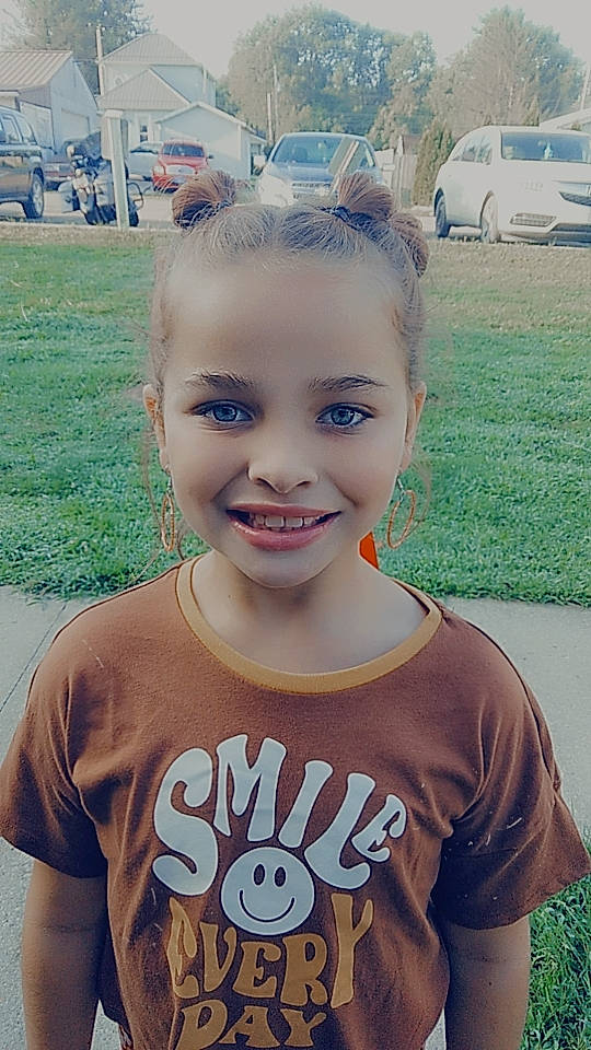 Brynleigh is registered to the contest to win money with this photo: child, chin, cool, electric_blue, eyebrow, eyelash, eyewear, forehead, fun, grass, happy, jaw, joy, lip, neck, person, plant, sleeve, smile, t_shirt