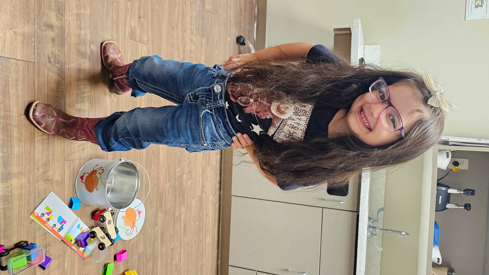 Raeleigh is registered to the contest to win money with this photo: door, eyewear, fun, fur, happy, joy, person, room, smile, tableware, walking_shoe, wood, wrist