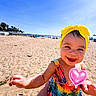 beach, child, colorful_dress, cute, fun, happy, heart_sticker, holiday, outdoor, person, playful, portrait, sand, sky, smiling, summer, sunny, toddler, vacation, yellow_headband