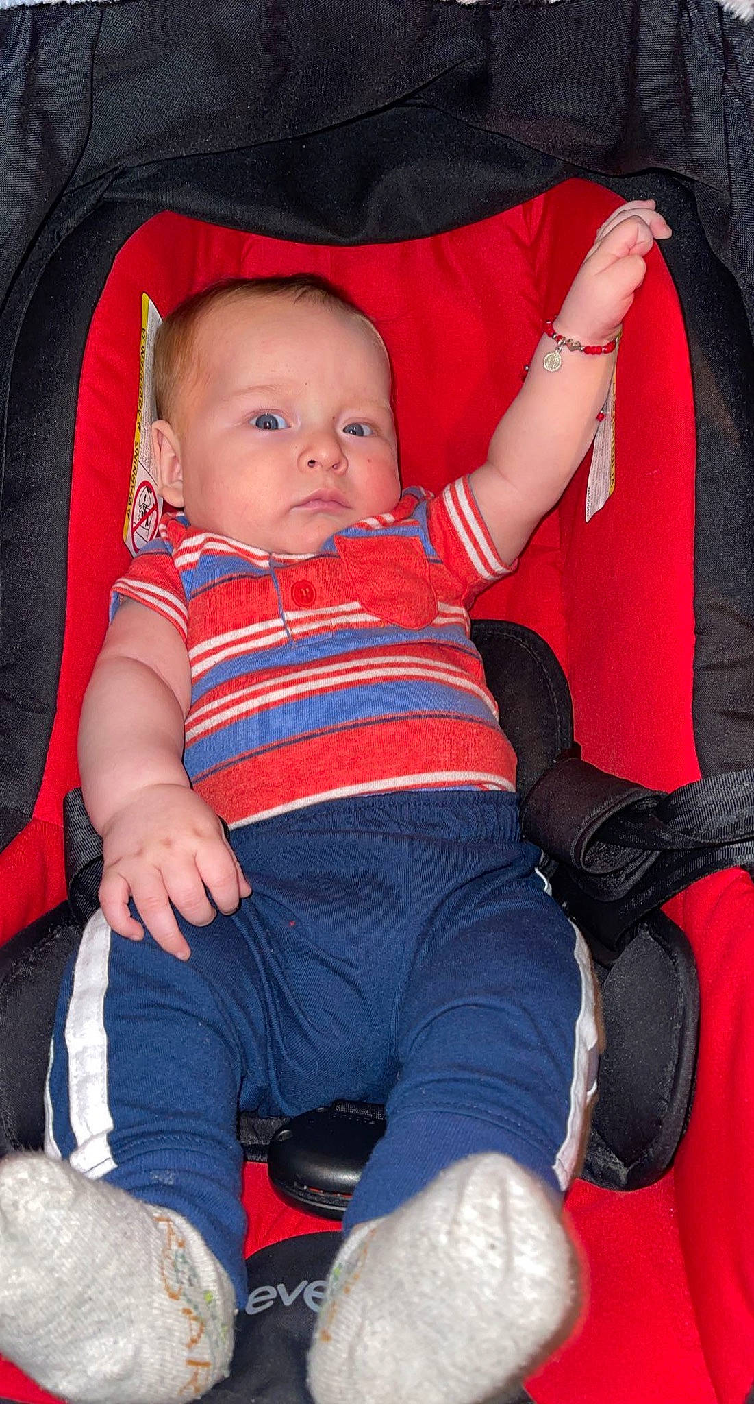 Gael joined the competition — help win amazing prizes! baby, baby_toddler_clothing, cheek, comfort, eye, face, finger, hand, head, human_body, iris, lap, leg, mouth, orange, person, red, skin, sleeve, textile