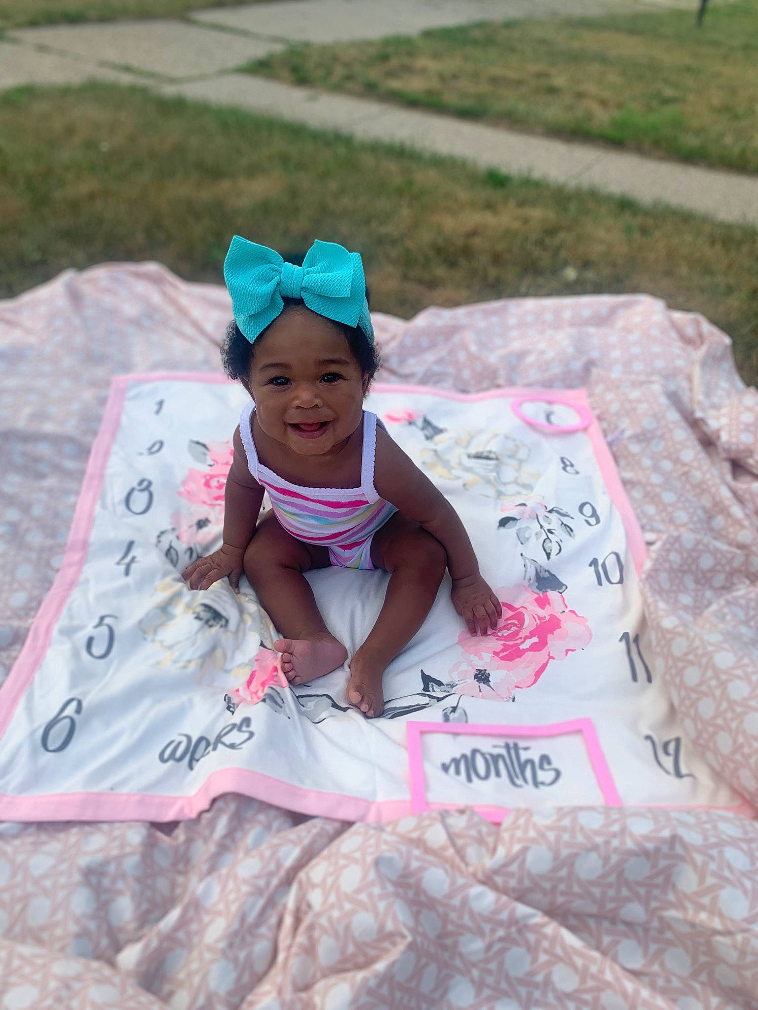 Kenzley is registered to the contest to win money with this photo: baseball_cap, cap, child, event, fun, grass, happy, hat, headwear, joy, leisure, magenta, pattern, person, pink, play, recreation, sleeve, smile, soil