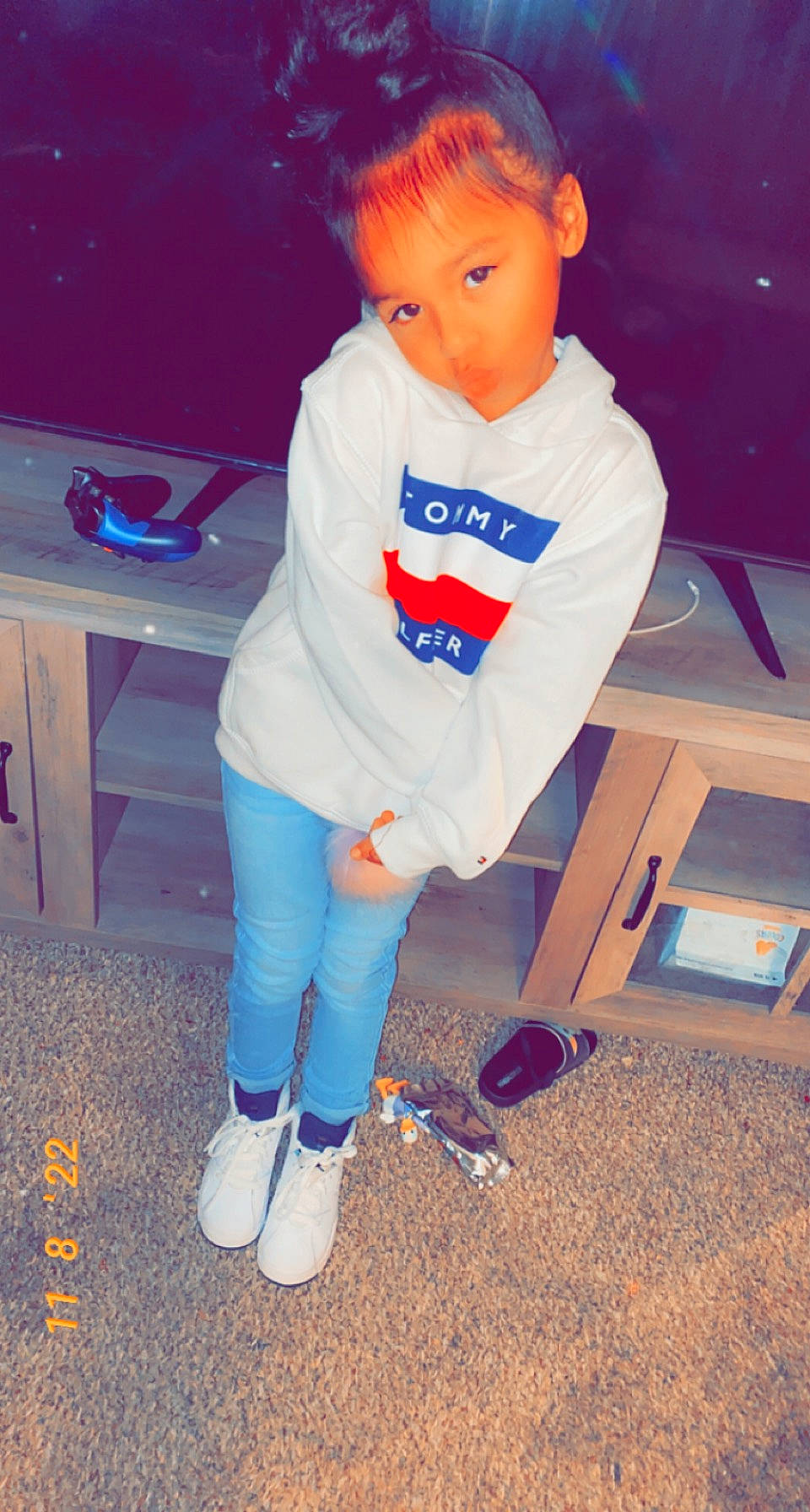 Leighton is registered to the contest to win money with this photo: baby_toddler_clothing, clothing, cool, electric_blue, face, flooring, fun, human_leg, knee, leg, long_sleeved_t_shirt, person, shoe, sleeve, sock, sportswear, standing, sweatpant, t_shirt, thigh