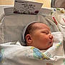 Aylin is registered to the contest to win money with this photo: newborn, baby, sleeping, blanket, hospital, bassinet, hat, face, infant, healthcare, card, hospital_bed, wrapped, peaceful, child, closeup, portrait, person, soft, resting