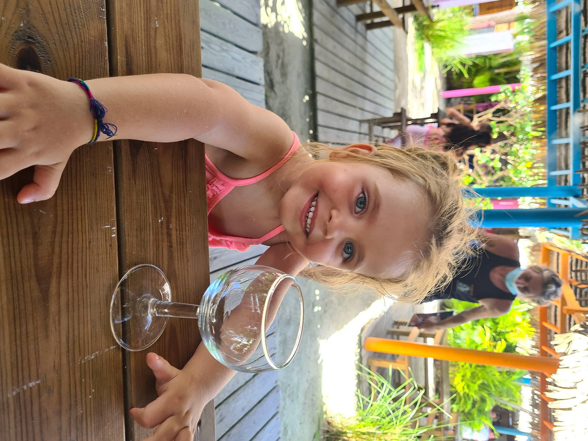 Agathe participe au concours pour gagner de l'argent avec cette photo : automotive_wheel_system, child, eyewear, fun, grass, happy, house, jewellery, joy, leisure, person, plant, recreation, smile, toddler, tree, vacation, water, wheel, window