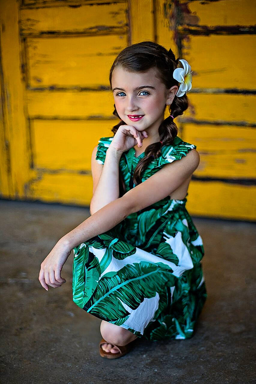 Preslie is registered to the contest to win money with this photo: child, child_model, dress, fashion_design, green, joy, person, photo_shoot, photography, shoulder, sitting, smile, trunk, yellow
