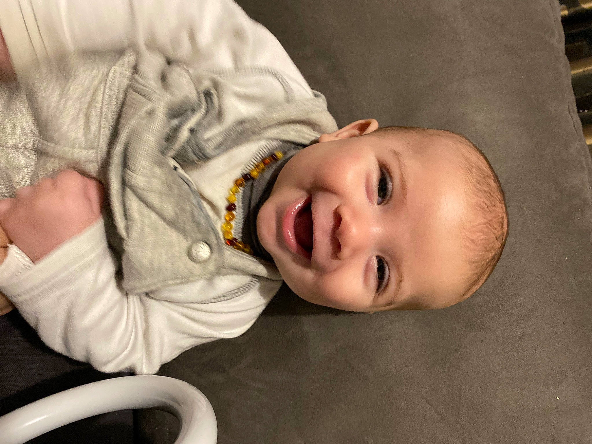 Keyan participe au concours pour gagner de l'argent avec cette photo : baby, baby_laughing, baby_toddler_clothing, cheek, child, comfort, eyebrow, face, flash_photography, happy, lip, mouth, nose, person, sitting, skin, sleeve, smile, toddler, tree