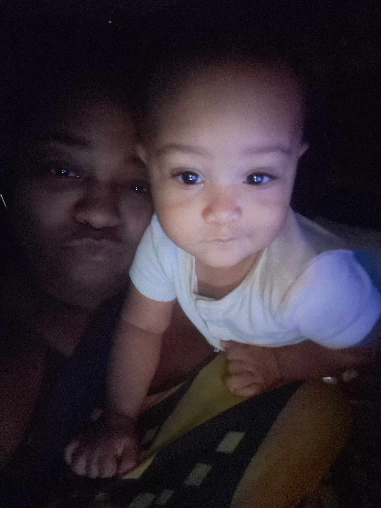 La'Shaunni joined the competition — help win amazing prizes! baby, child, person, face, portrait, indoor, dark, lighting, curious, white_shirt, closeup, infant, hand, adult, family, expression, skin, eyes, baby_girl, baby_boy