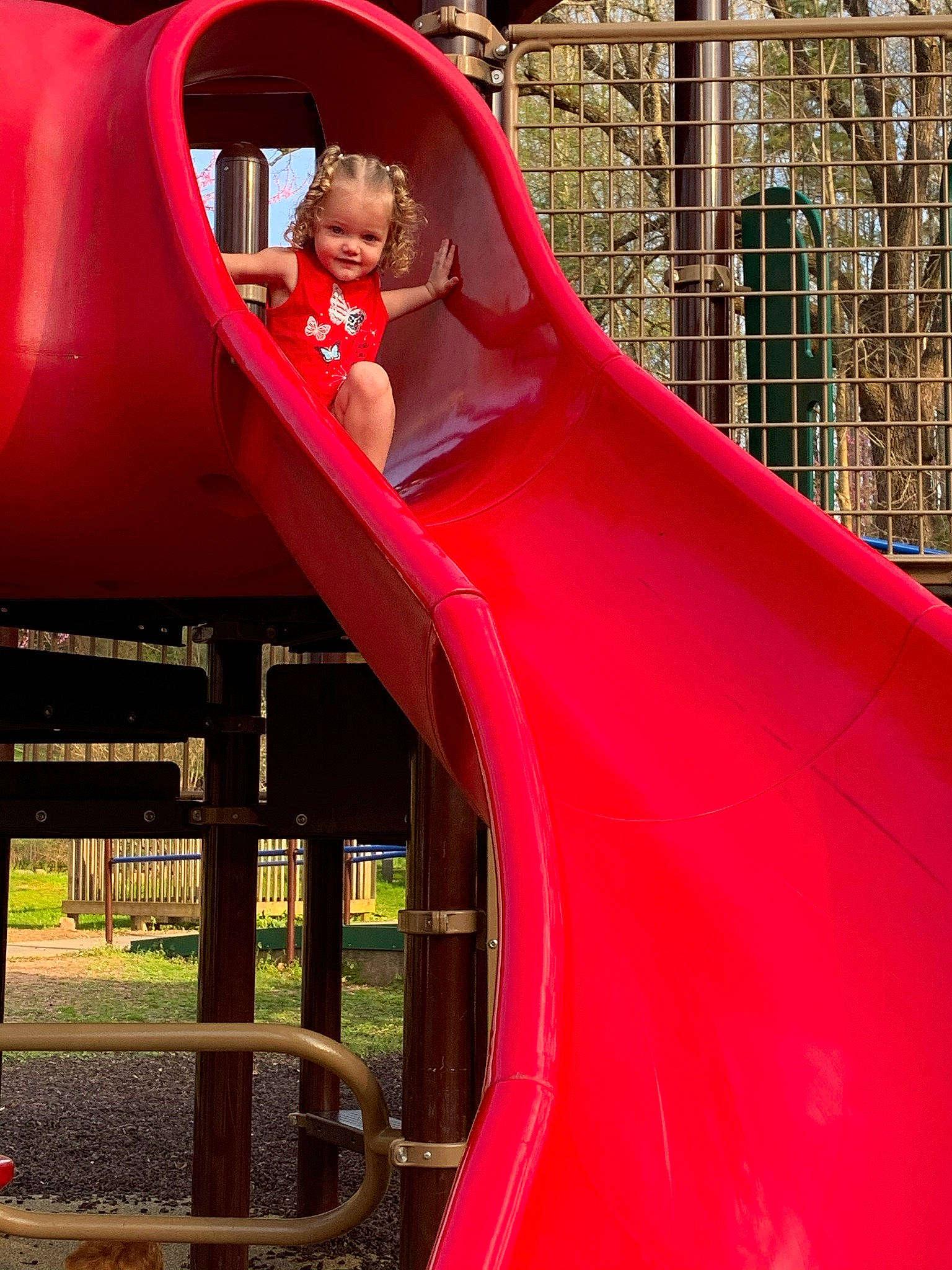 Rowan joined the competition — help win amazing prizes! baby_toddler_clothing, child, chute, city, fun, joy, leisure, magenta, outdoor_play_equipment, person, photograph, pink, plant, play, playground, playground_slide, recreation, red, smile, snapshot