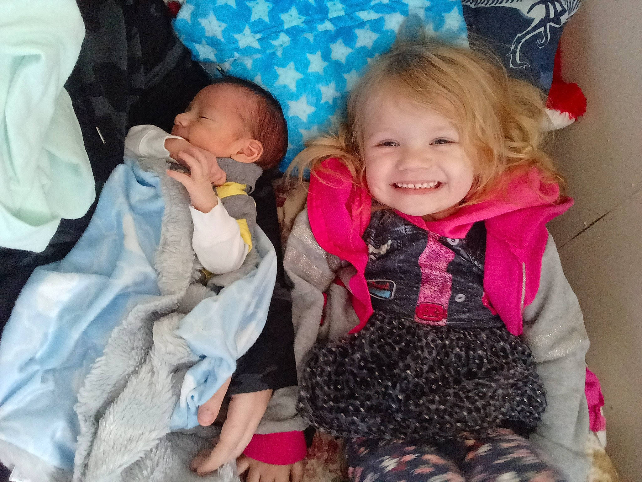 Elizah joined the competition — help win amazing prizes! baby, baby_products, baby_toddler_clothing, blue, child, comfort, event, facial_expression, fun, gesture, happy, joy, linens, pattern, person, pink, skin, sleeve, smile, textile