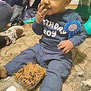 Veyquan joined the competition — help win amazing prizes! child, toddler, birthday, boy, cake, frosting, eating, smiling, sitting, party, blue_outfit, ribbon, indoors, carpet, dessert, food, finger_food, messy, playpen, celebration