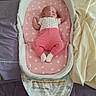 Ivy is registered to the contest to win money with this photo: baby, bassinet, bed, blanket, clothing, cozy, crib, furniture, home, indoor, infant, lying_down, peaceful, pink, pink_pants, polka_dot, portrait, sleeping, socks, white_shirt