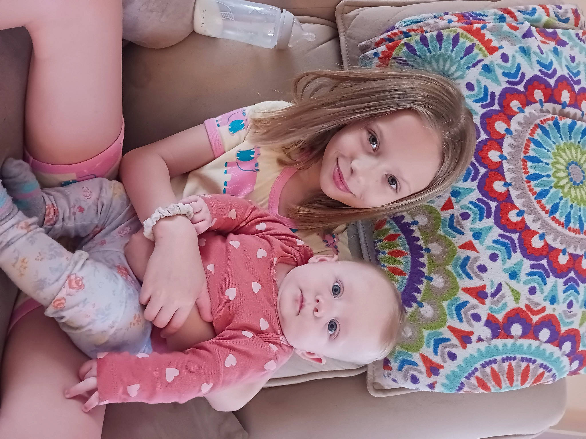 Lydia is registered to the contest to win money with this photo: arm, baby, baby_toddler_clothing, child, comfort, eye, facial_expression, hairstyle, hand, happy, head, human_body, joy, leg, organ, people, person, pink, product, skin