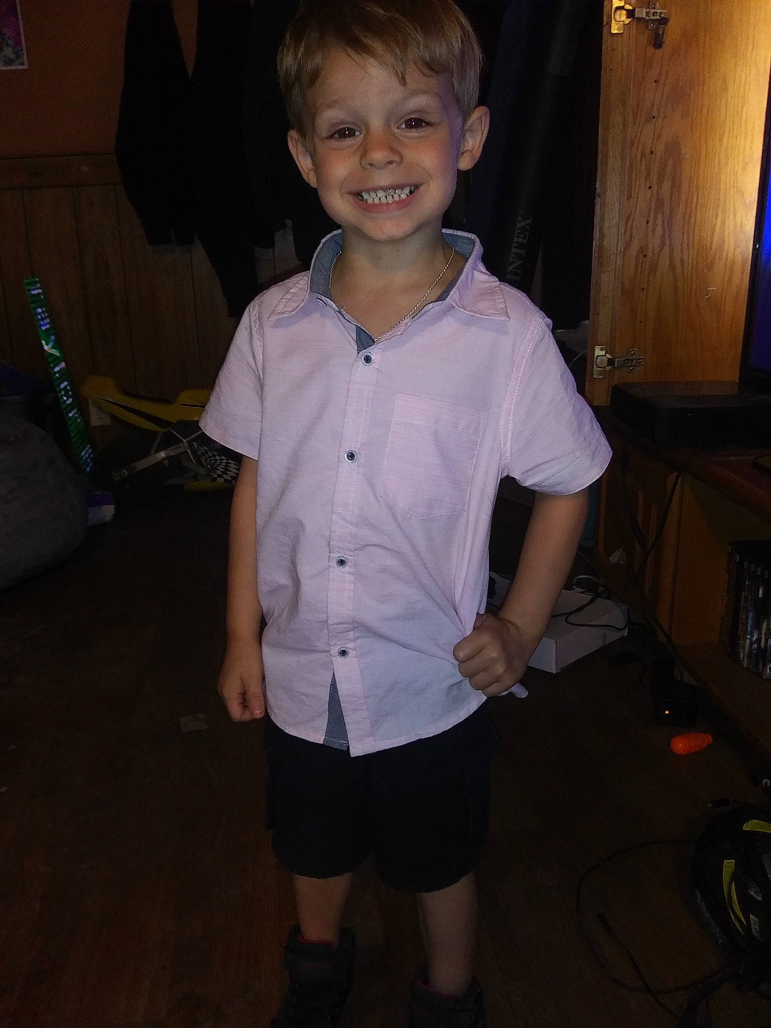 Ryder is registered to the contest to win money with this photo: child, fun, joy, outerwear, person, school_uniform, sleeve, smile, standing, t_shirt, toddler, vacation