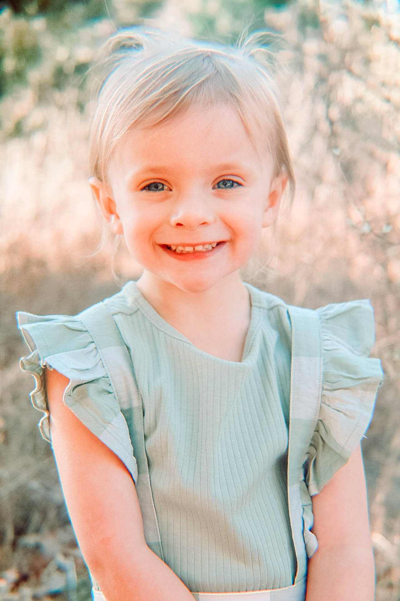 Hazel joined the competition — help win amazing prizes! blond, child, eye, face, flash_photography, grass, happy, iris, joy, leaf, lip, people_in_nature, person, plant, shoulder, skin, sleeve, smile, standing, toddler